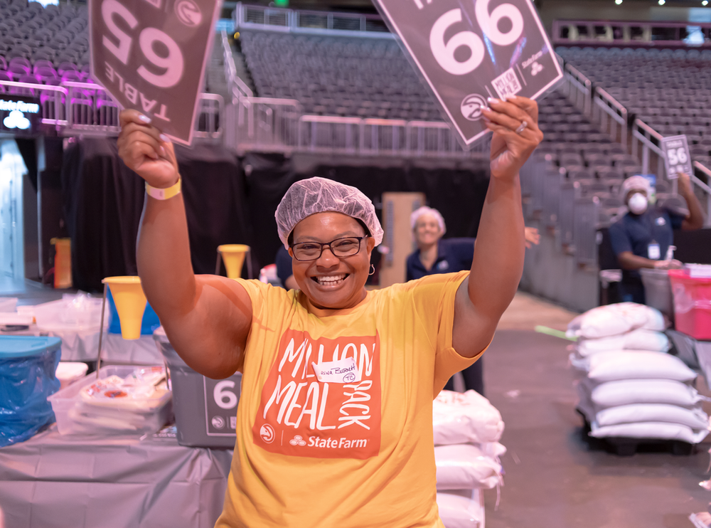 Meal Trainer Mrs. Barnett ready to receive volunteers at State Farm Arena.